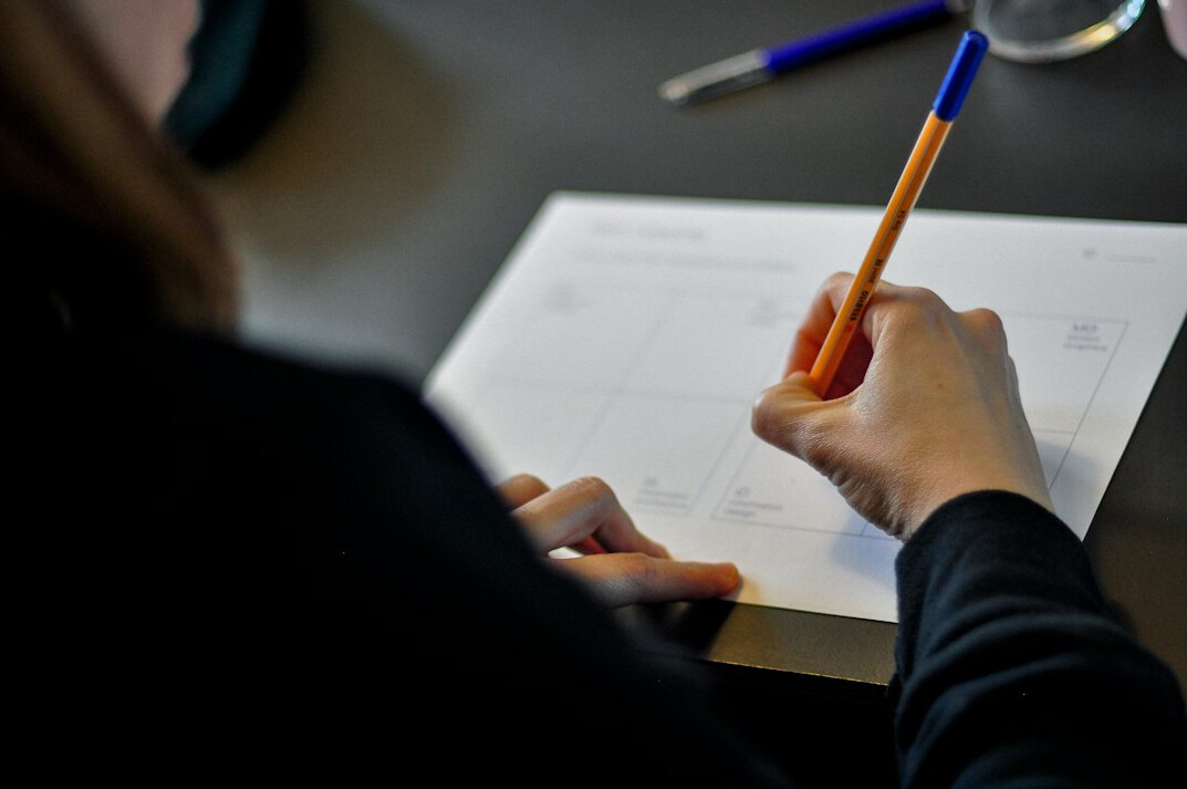 person solving crossword